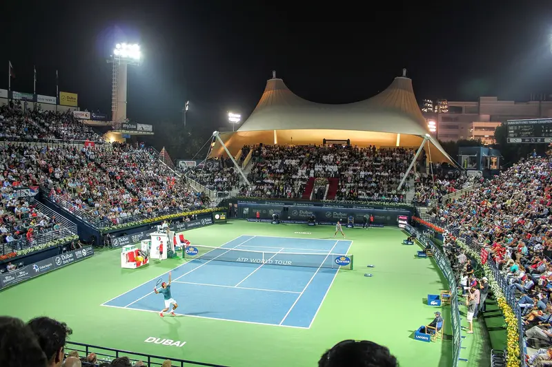 The centre court of the Dubai Tennis Championships lit at night during a semi-final