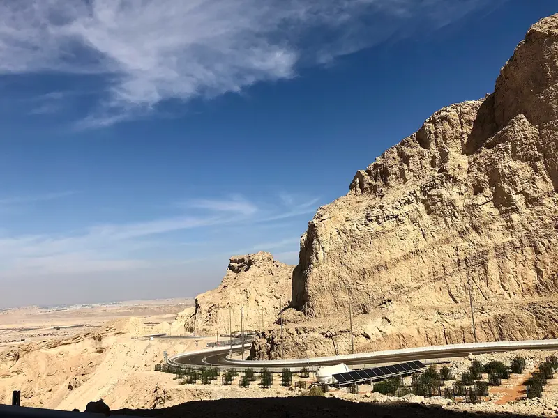The limestone flank of Jebel Hafeet above Al Ain with the switchback road below
